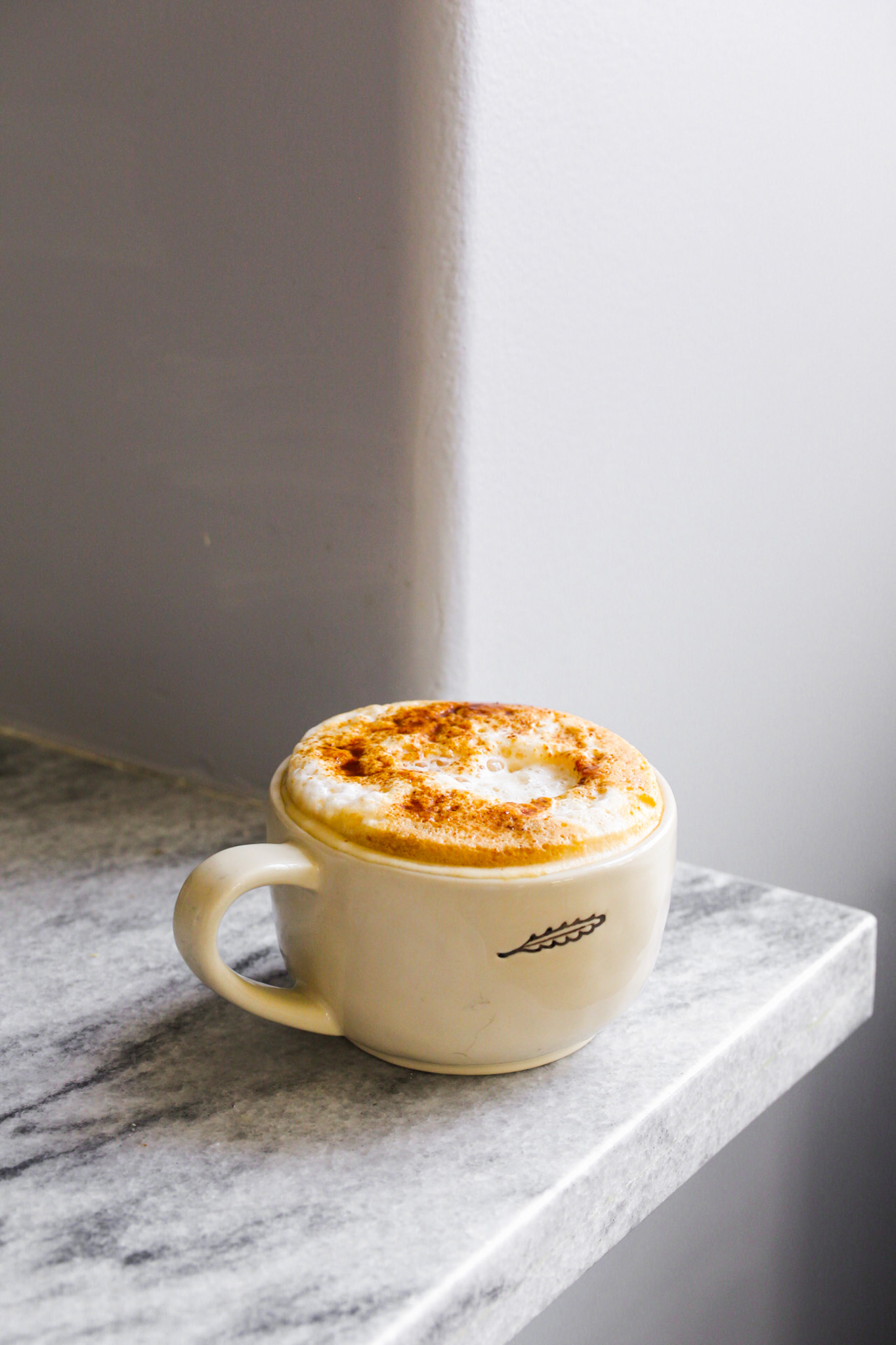foamy latte in mug
